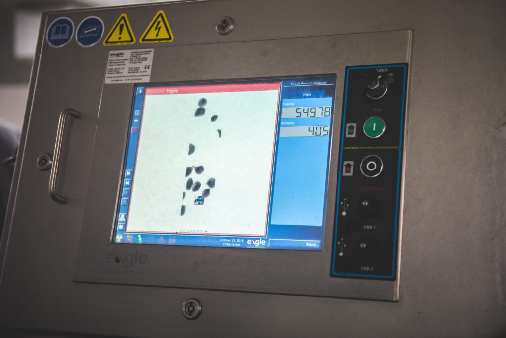 EaglePI x-ray equipment technician adjusting inspection system